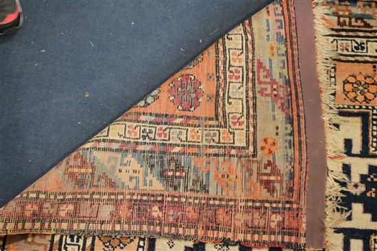 A Derbend apricot ground rug, c.1910, 9ft 6in by 3ft 6in.